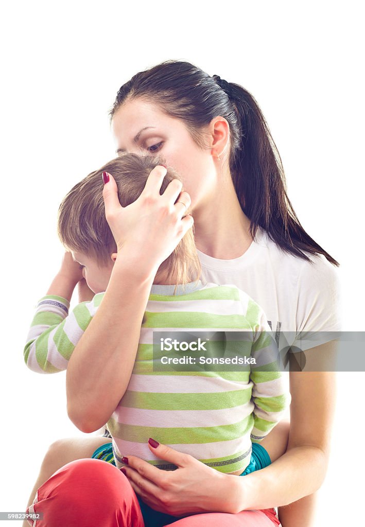 Mother calms a crying child Mother calms a crying child isolated on white background Adult Stock Photo