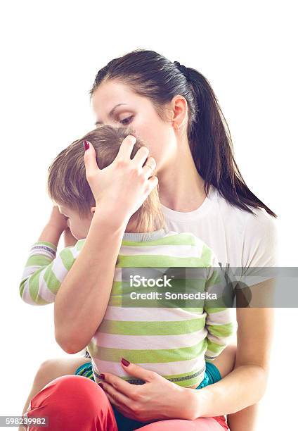 Mother Calms A Crying Child Stock Photo - Download Image Now - Adult, Affectionate, Black Color