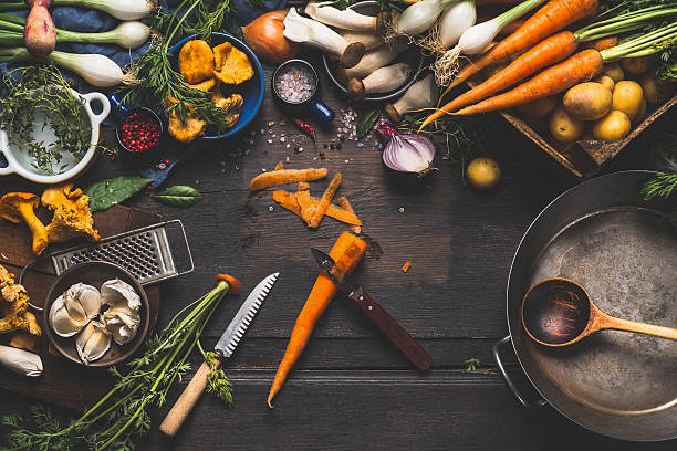 istock Cooking with forest mushrooms and  vegetables ingredients, top view 598240294