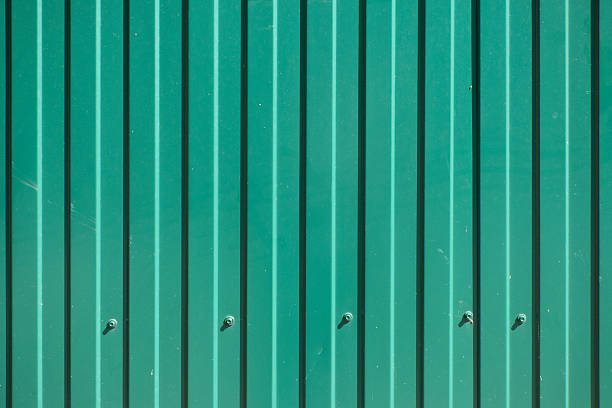 istock Green goffered metal texture with screw heads 598243014
