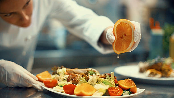 istock Chef placing finishing touches on a meal. 598243064