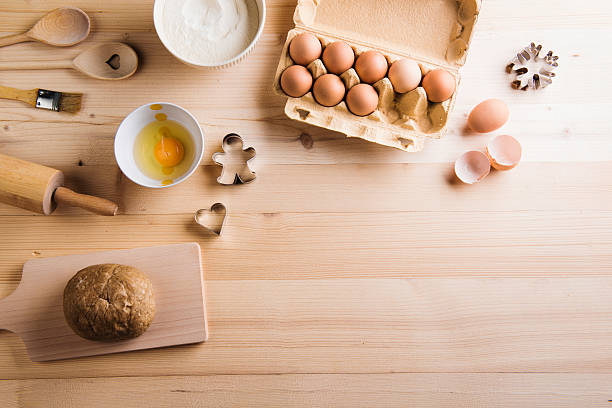 istock Baking ingredients and kitchen utensils. Wooden backround. Copy 598245280