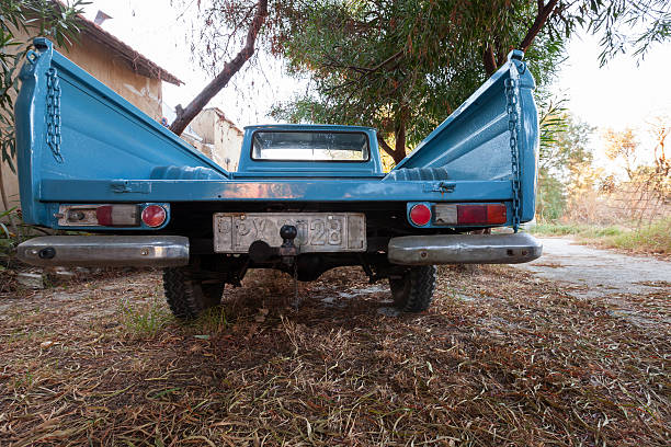Zakynthos, Greece - August 16, 2016: close up front view of old blue Datsun 1300 pickup car