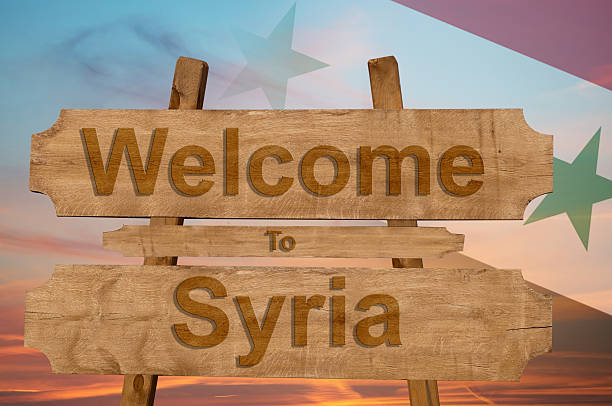 istock Welcome to Syria sign on wood background 598247152