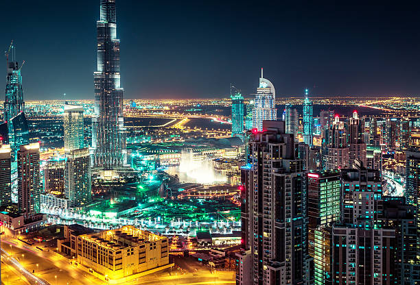 istock Fantastic nighttime skyline of a big city with illuminated skyscrapers 598247196