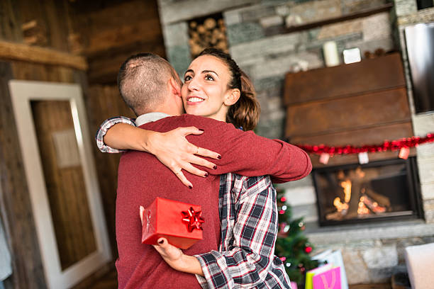istock giving the present to the girlfriend for christmas 598247696
