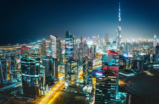 istock Fantastic nighttime skyline of a big city with illuminated skyscrapers 598247736