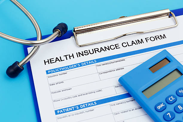 istock Health insurance claim form with calculator 598248060