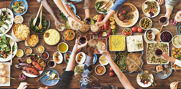 istock Friends Happiness Enjoying Dinning Eating Concept 598248114