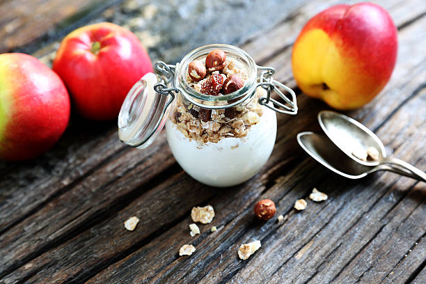 istock White yogurt with granola and fruits 598248422