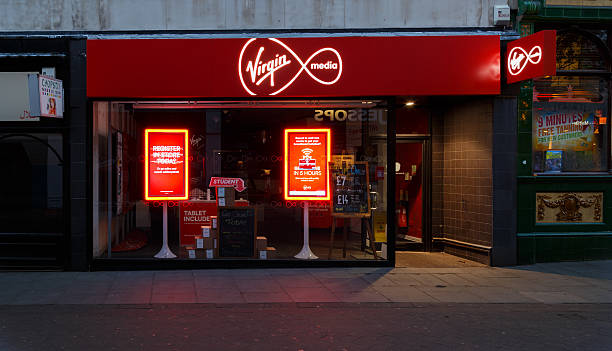 Frontage of the Virgin Media store at night, Nottingham Nottingham, England - August 30, 2016: Frontage of the Virgin Media store at night on Clumber Street. In Nottingham, England. On 30th August 2016. nottinghamshire stock pictures, royalty-free photos & images