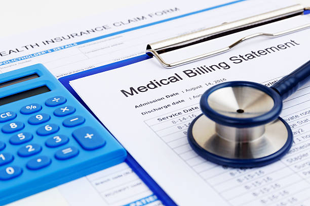 Medical bill and insurance form with calculator Medical bill and health insurance form with calculator bill stock pictures, royalty-free photos & images