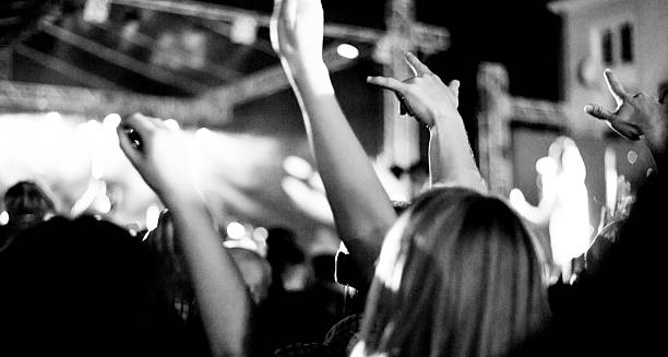 istock fans during a live concert, visible noise due high ISO 598251050