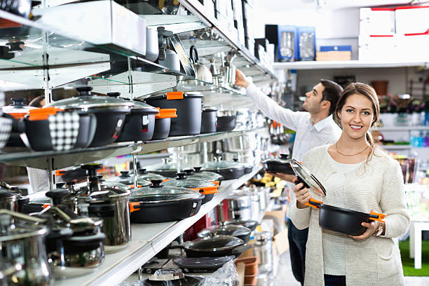 istock Young positive couple in the cookware section 598251752