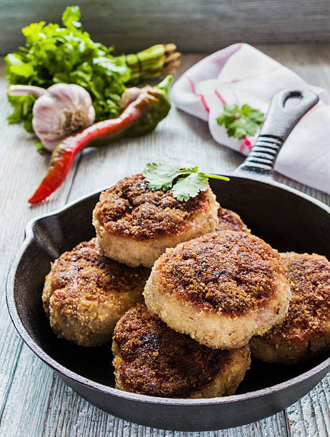 istock Homemade chicken roasted cutlets in black cast-iron pan 598252188