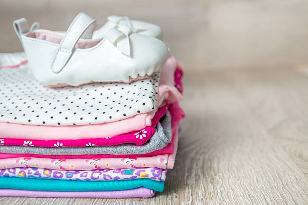 istock Folded pink and white bodysuit with shoes 598252464