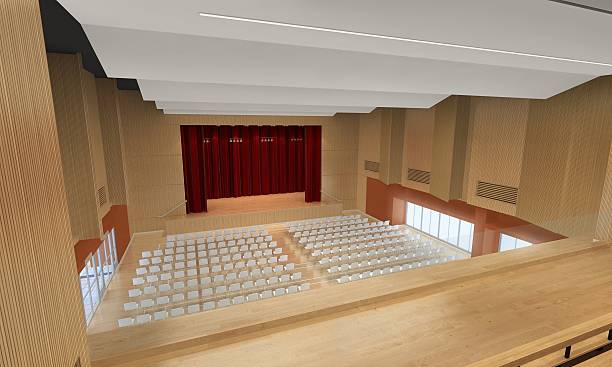 Empty seats arranged side by side in illuminated university auditorium