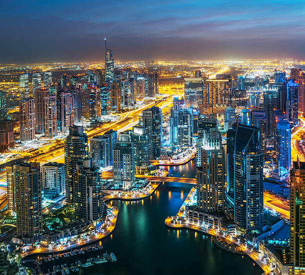 istock Illuminated architecture of Dubai by night. Scenic skyline. 598253038
