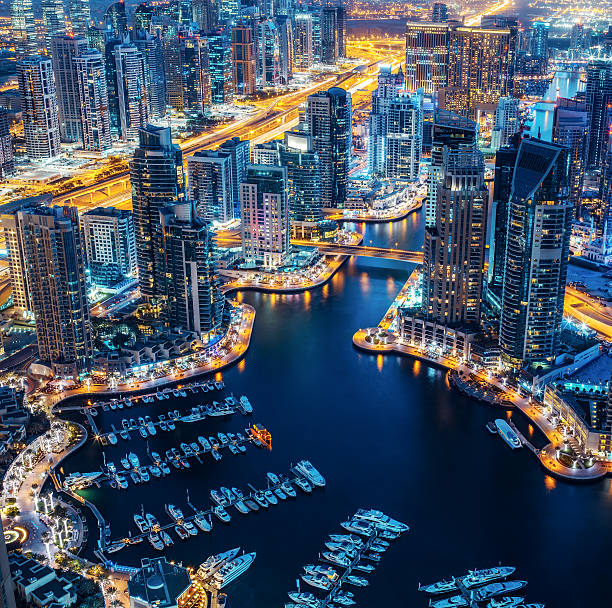 istock Illuminated architecture of Dubai by night. Scenic skyline. 598253314