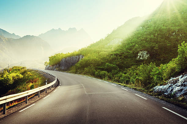 istock road and mist, Lofoten islands, Norway 598253630