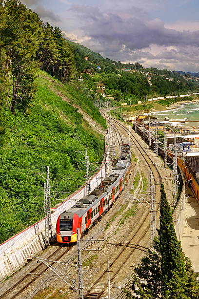 istock Mountain Railway, Modern Train Background With Trees And The Seashore 598254386