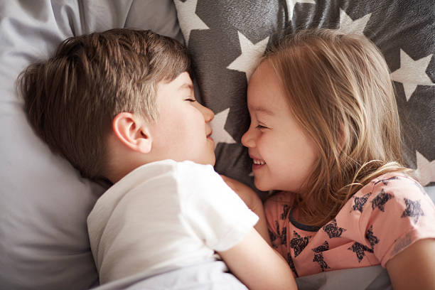 istock Little children pretending to sleep 598256308