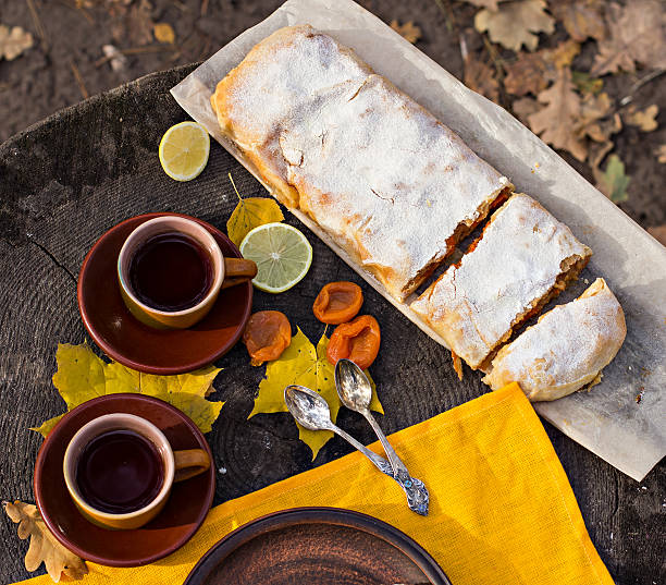 istock Strudel with apples, pumpkin, apricots, lemon. Autumn table decoration 598257324
