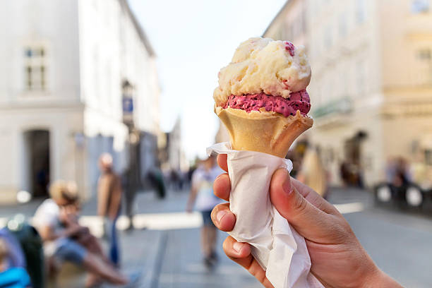 istock Delicious ice cream cone held up in the Krakow. Poland. 598257880