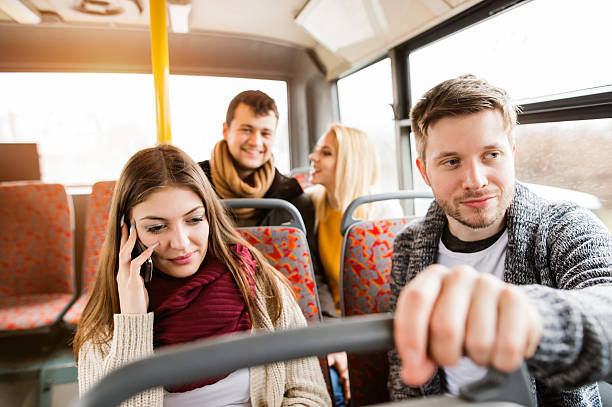 istock Group of young people traveling by bus, having fun 598258238