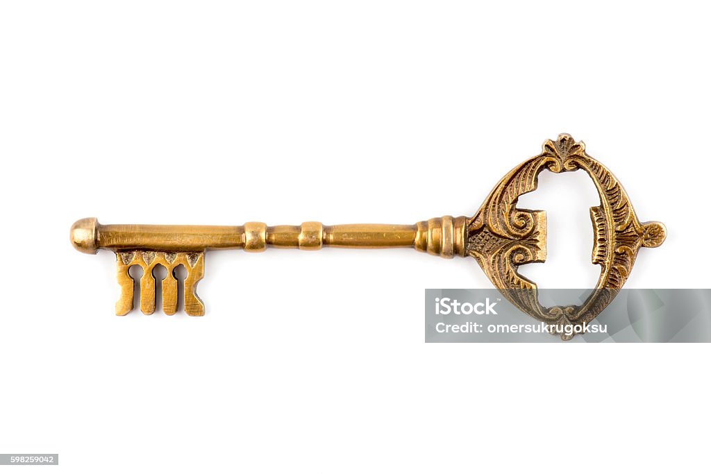 Old and mystic key An old and mystic key that is rather large in size isolated on white background. Key Stock Photo