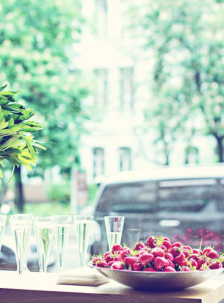 istock Dish with strawberries and champagne glasses on the table. 598259146