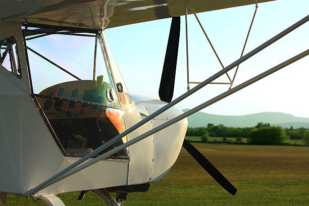 istock Ultralight aircraft in sunset 598259222