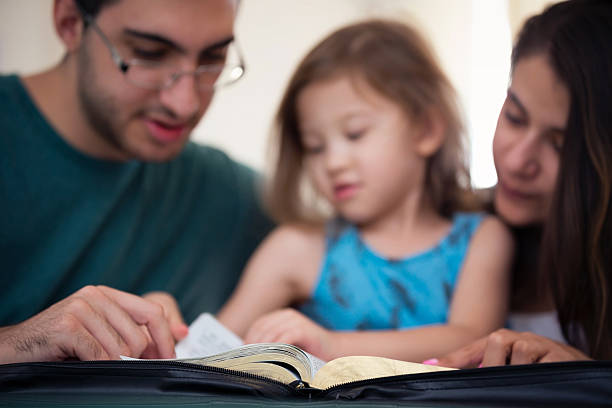 istock Family Reading the Bible Together 598259958