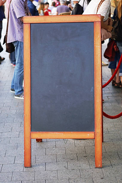 istock blank blackboard advertising sign or customer stopper 598260540