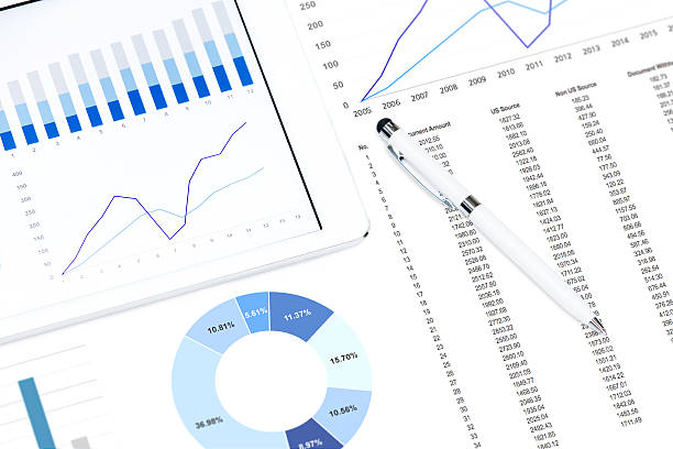 istock Business chart on the tablet pc and printed media 598260702