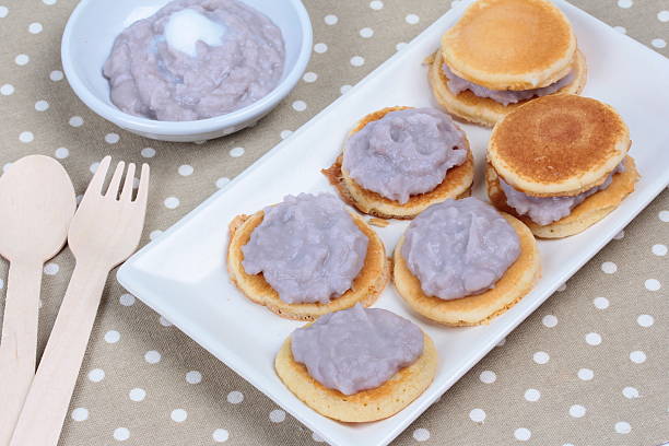 istock Mini pancake topped stirred taro on gray. 598261332