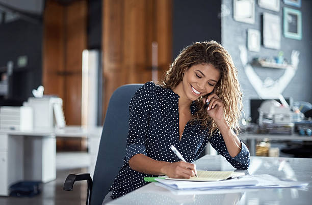 Taking notes of her business call