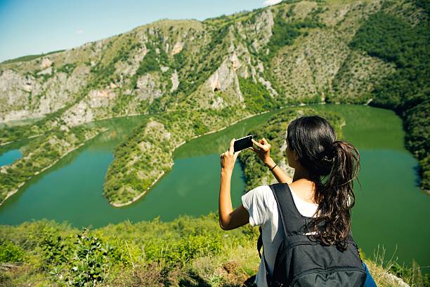 istock Tourist taking picture of beautiful river 598261746