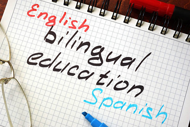 Sign bilingual education written in a notepad on a table. Sign bilingual education written in a notepad on a table. bilingual stock pictures, royalty-free photos & images