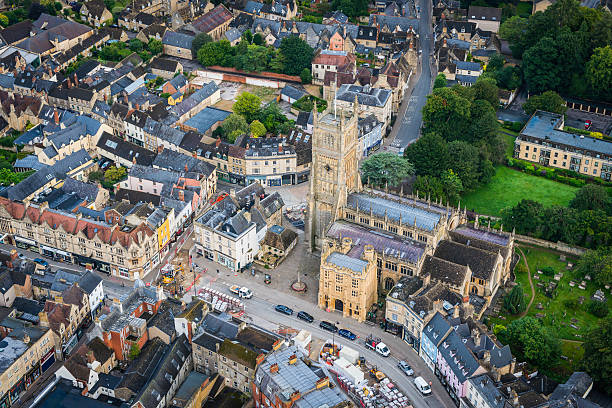 cirencester abbey pretty cotswold country town centre aerial view uk - cotswold stockfoto's en -beelden