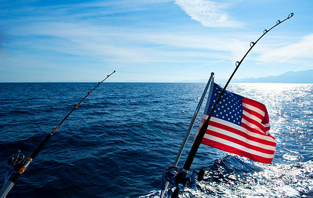 bandiera americana e canna da pesca d'altura - pesca daltura foto e immagini stock