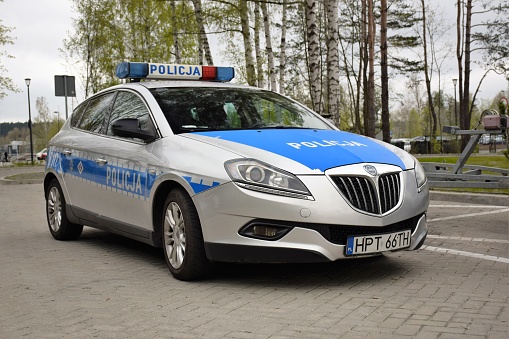 Olsztyn, Poland - May 1st, 2016: Lancia Delta police car stopped on the street. These vehicles are used to patrols on the streets.