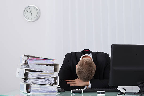 istock Male Businessman Sleeping In Office 598524380
