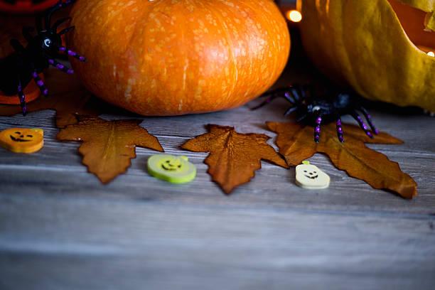 istock Halloween pumpkin head jack lantern on wooden background 598524624