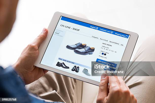 Man Shopping Online Stock Photo - Download Image Now - Internet, Digital Tablet, Shopping