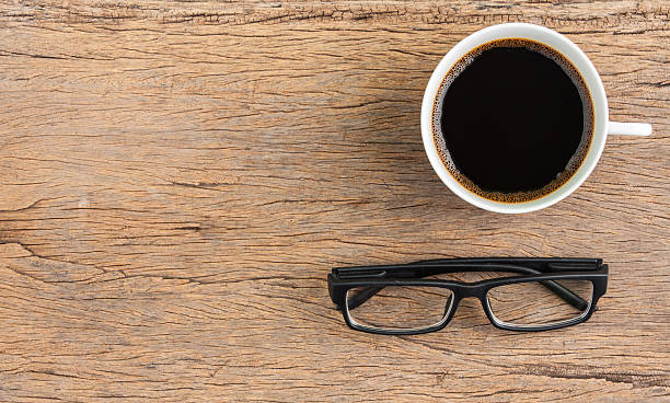 istock coffee and glasses on wooden table background, top view 598526978