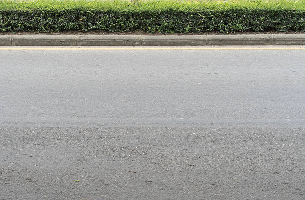 Asphalt road with concrete curb