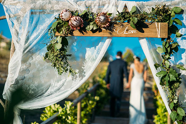 istock Newlyweds walk and hold hands 598528724