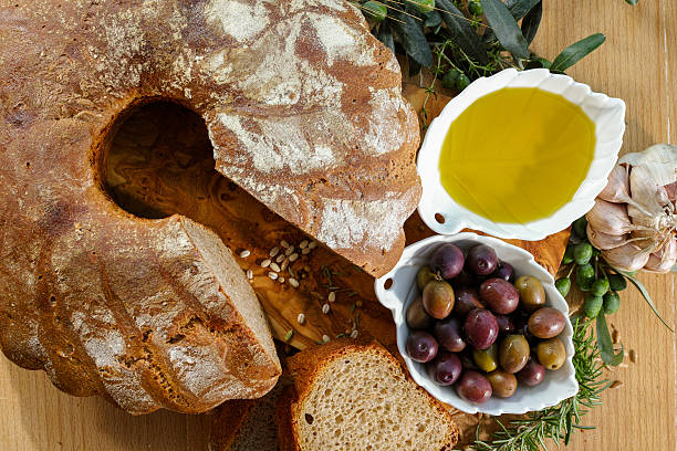 istock Freshly baked homemade sourdough spelt bread, extra virgin olive 598528982
