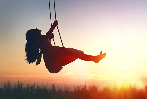 istock child girl on swing 598530406